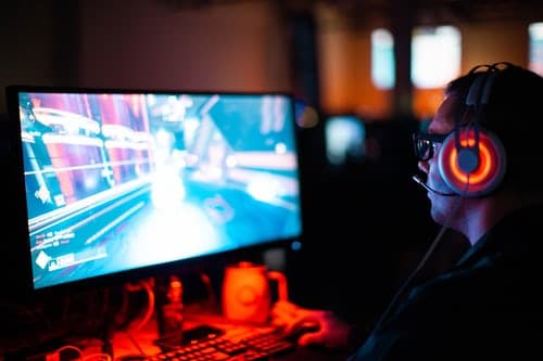 A Valorant player sitting in front of a computer